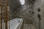 Upper Level Bathroom with Tiled Shower & Jetted Jacuzzi